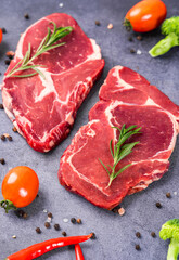 Fresh beef steak on a concrete background