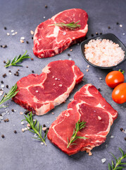 Fresh beef steak on a concrete background