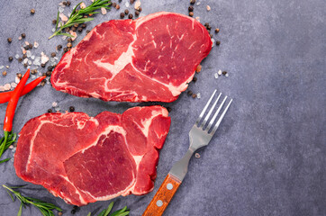 Fresh beef steak on a concrete background