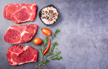 Fresh beef steak on a concrete background