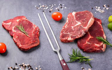 Fresh beef steak on a concrete background