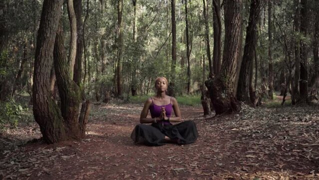 woman meditating while in lotus pose