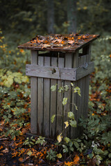 Wooden garbage can in the forest