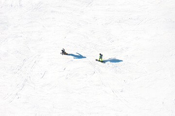 Ski resort. An aerial view of the snowboarding team. Winter sports. Snow slope in the mountains for...