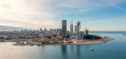 Batumi, Adjara, Georgia. Aerial panorama view from drone with modern buildings on seafront promenade. Beautiful resort town on Black Sea.