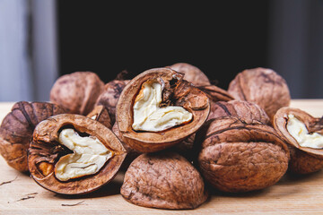 Walnut. Half walnut on natural background. Inshell nuts. Copyspace.