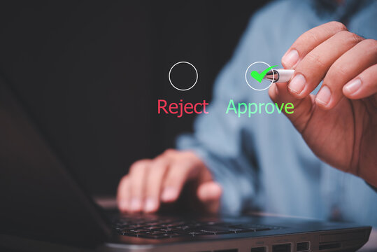 The guy selects green approve from the options on the virtual screen