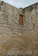 Limestone block and mud wall construction of the Alamo upper shuttered window