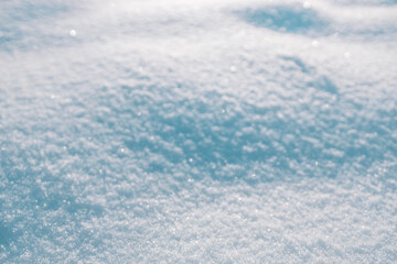 Winter background with pile of snow and blur landscape. Copyspace for text. High quality photo