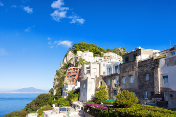Fototapeta na wymiar Touristic Town on Capri Island in Bay of Naples, Italy. Sunny Blue Sky.