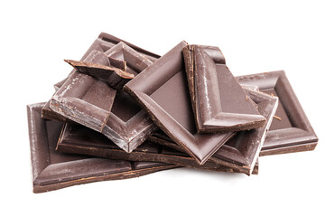 Dark chocolate pieces, cubes on a heap, broken chocolate isolated on white background