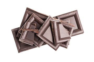 Dark chocolate pieces, cubes on a heap, broken chocolate isolated on white background, top view