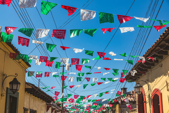 Garlands strung across a street between buildings; San Cristobal de las Casas, Chiapas, Mexico