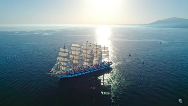 huge sailing yacht with open sails at sea