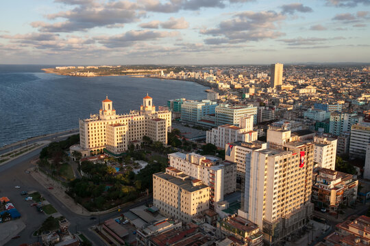 Cuban flags hanging from several buildings are visible in this aerial view of downtown Havana.; Havana, Cuba