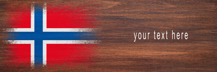 Flag of Norway. Flag is painted on a wooden surface. Wooden background. Plywood surface. Copy space. Textured background