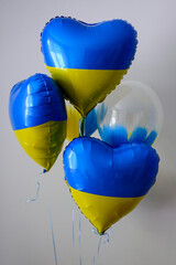 Balloons in shape of heart in color of Ukraine's flag.