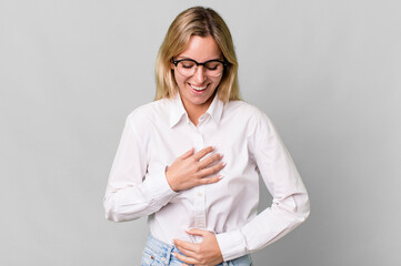 caucasian blonde woman laughing out loud at some hilarious joke