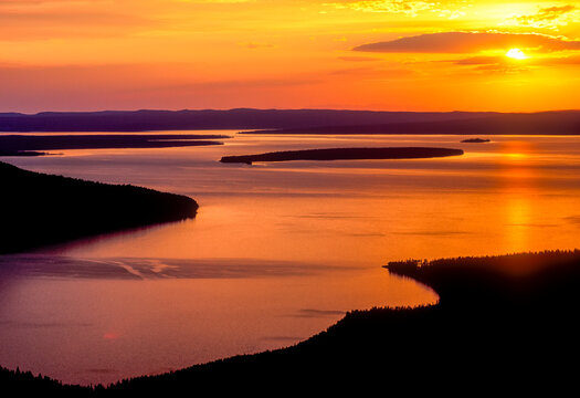 A golden sunset reflected off the surface of Yellowstone Lake.