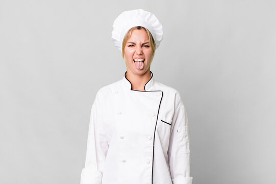 Caucasian Blonde Woman Feeling Disgusted And Irritated And Tongue Out. Chef Concept