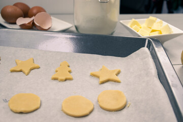 tray with cookies ready to bake and their base ingredients