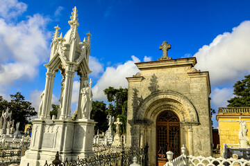 Oranate sculptures adorn mausoleums at a graveyard in Havana.