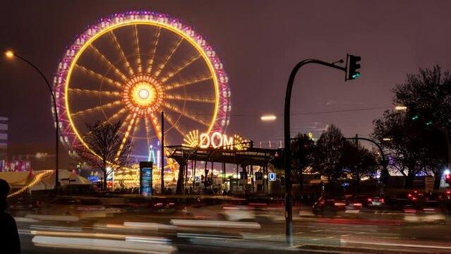 Time lapse: Entrance of Hamburger Dom fair with Ferris wheel: The Hamburger Dom is a large fair held at Heiligengeistfeld fair ground in central Hamburg, Germany.