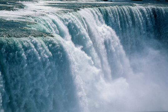 A cascade of water thunders over Niagara Falls.; Niagara Falls, New York.