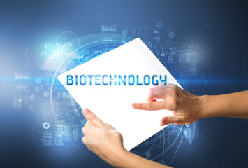 Hand holdig futuristic tablet , technology concept