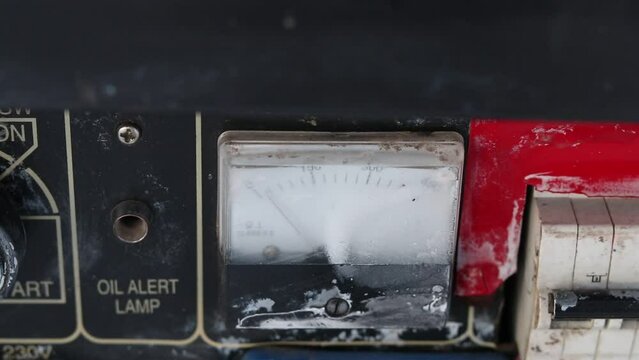 natural light. winter, snow, frost. everything is covered with frost. the ammeter arrow shows the minimum value. the arrow shows the decline of eletricity. close-up.