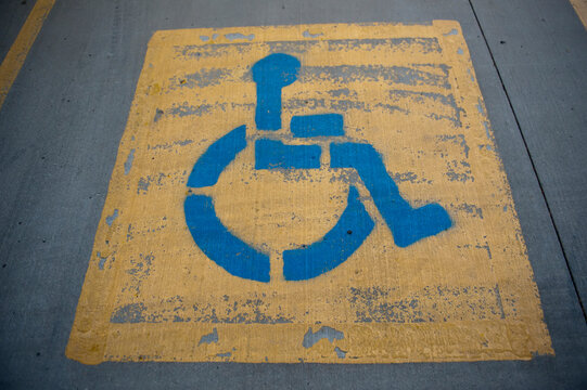 Paint chipping off of a handicapped parking spot; Lincoln, Nebraska, United States of America