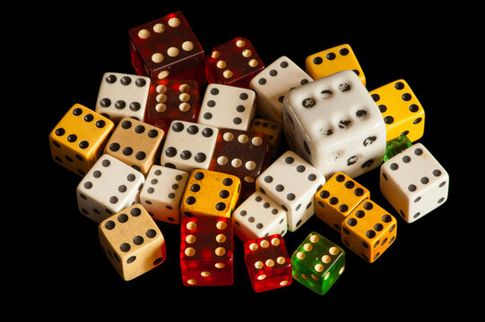 Studio image of dice on a black background; Studio