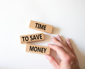 Time to save money symbol. Wooden blocks with words Time to save money. Businessman hand. Beautiful white background. Business and Time to save money concept. Copy space.
