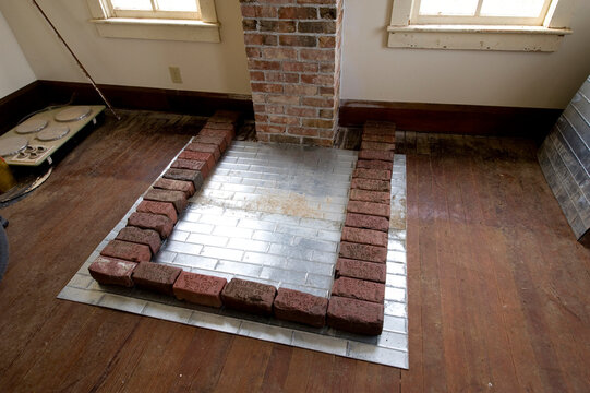 Base of a wood stove being built in an old farmhouse in Nebraska, USA; Dunbar, Nebraska, United States of America