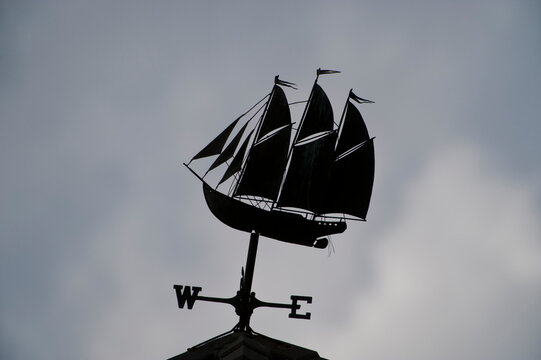 Silhouetted weather vane with ship; Yulee, Florida, United States of America