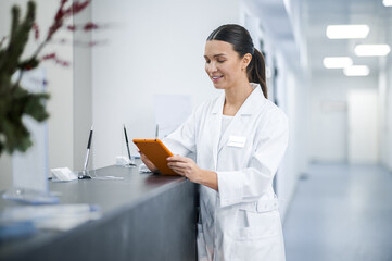 Smiling female doctor in the clinic reception