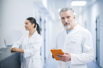 Two doctors talking in the hospital during the shift change