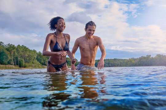 Couple messing about in a lake in France.