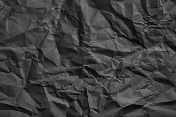 Crumpled black texturized graphite paper
