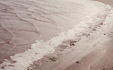 Bay of the lake with space for text. Texture waves shore with sunlight. Lake Leucate in the south of France in Languedoc Roussillon in France. Landscape in Luecate, Aude.  