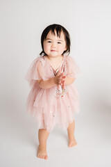 little girl in a pink dress