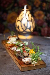 assorted bruschetta with different flavors on a wooden board