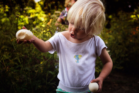 Little boy with a broken egg.