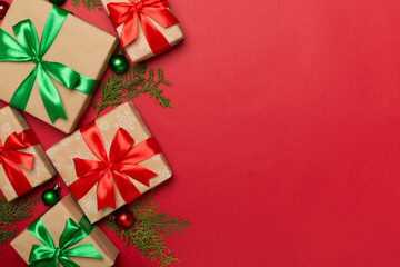 Gift boxes with decor on color background, top view