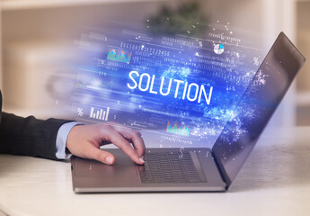 Closeup of businessman hands working on laptop
