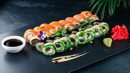 Assorted Japanese sushi roll set with salmon, tuna, avocado, Philadelphia cheese, cucumber, seaweed, soy sauce, wasabi and ginger. © smspsy