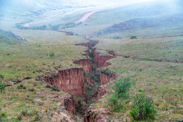 a large crack in the ground after seismic activity