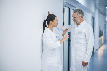 Female doctor rejecting flirty behavior of her male colleague