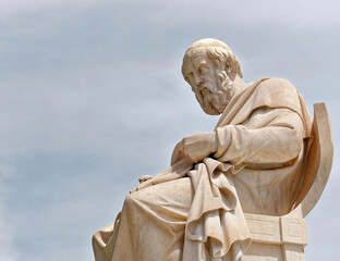 Fototapeta premium Plato the ancient Greek philosopher's marble statue. Culture travel in Athens, Greece.