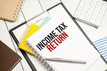 income tax return. Conceptual background with chart ,papers and pen